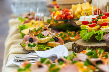 Banquet Table in restaurant served with different meals.