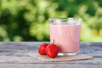 strawberry smoothie on natural background