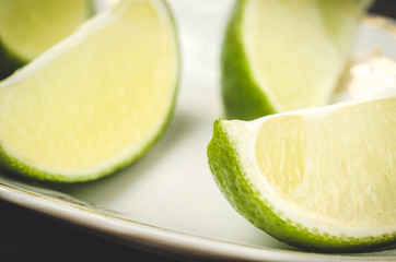 abundance of a lime on a white plate/abundance of a lime close up
