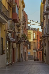 Fototapeta na wymiar Old street in a small Spanish town Palamos in Spain