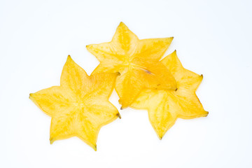 Fototapeta premium Star fruit on white isolated background translucent delicious natural sweet shape starfruit food texture detail macro close up carambola graphic pattern