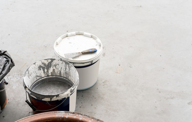 Dirty or used color buckets and construction equipment