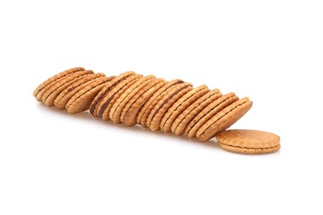 Round biscuits with chocolate filling on a white background
