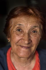 Portrait of an elderly woman on a dark background