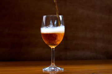 Wine in the glass on the table.