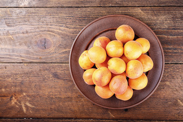 Ripe apricot wood background