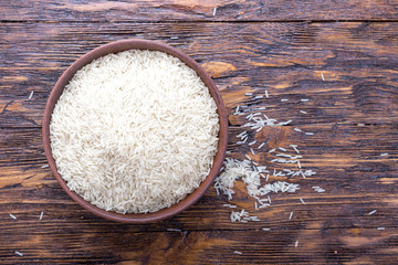Fototapeta na wymiar rice on a wooden background