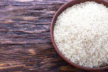 Fototapeta na wymiar rice on a wooden background