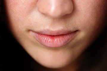 Naklejka premium Close up shot of the full lips young woman
