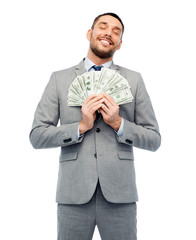 smiling businessman with american dollar money