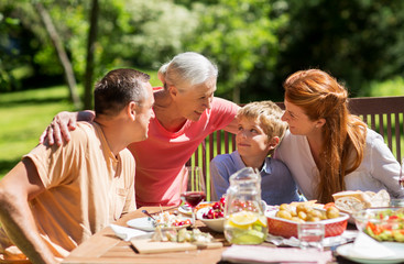 happy family having dinner or summer garden party