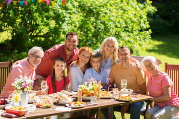 happy family having dinner or summer garden party