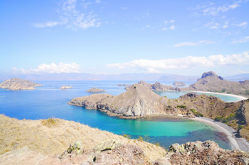 Obraz premium Padar Island with scenic high view of three beautiful white sandy beaches surrounded by a wide ocean and part of komodo national park in Flores, Indonesia