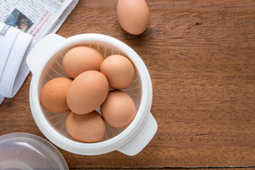 Raw Eggs on wooden table.