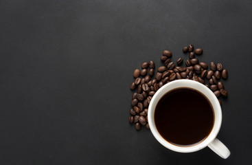 Coffee Beans with cup of coffee on black background