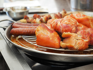 Roasted sausages and pork knees.