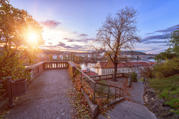 Autumn in Prague, golden sunset at Vyshehrad. Panoramic view point to the river Vltava and Prague castle, Czech Republic, Europe