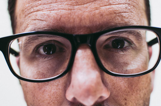 Close Up Of Man In Black Glasses