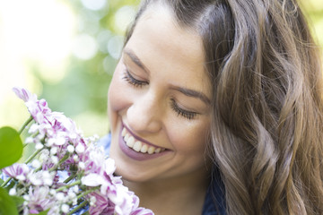 Fototapeta premium She really enjoys flowers
