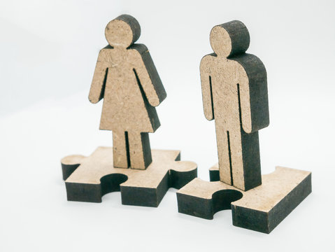 Wood carving men and women on white background.