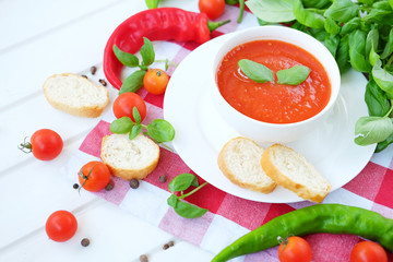 Cold summer tomato dish. Gaspacho soup with toast.