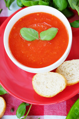 Cold summer tomato dish. Gaspacho soup with toast.