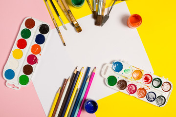 Paints brushes pencils paper colors mock up