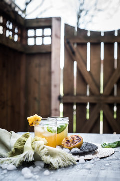 Pineapple lemonade on wooden table outdoors