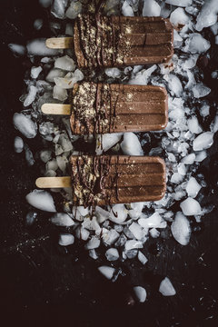 Row of smores popsicles on ice