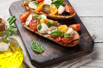 Bruschetta with tomatoes, mozzarella and basil