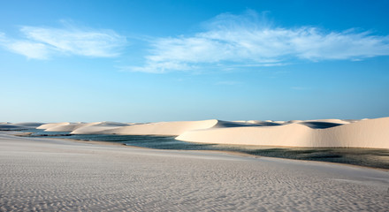 Lencois Maranhenses National Park, Brazil, low, flat, flooded land, overlaid with large, discrete sand dunes with blue and green lagoons