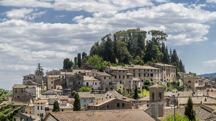 Fototapeta na wymiar Magnificent view of the ancient hilltop village of Cetona, Siena, Italy, on a beautiful sunny day with some white clouds