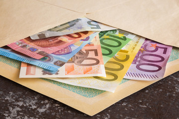 Euro paper money in the envelope. Received money as a present. Financial help.