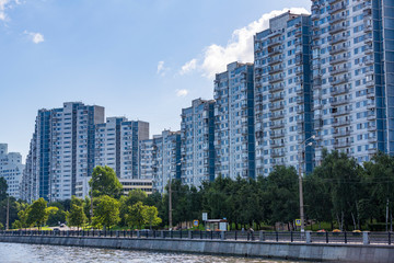 A large multi-storey building on the outskirts of the city. View from the Moscow River
