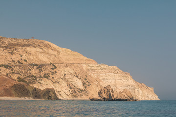 Fototapeta na wymiar View of the coast in the area a legendary rock the Petra tou Romiou, Aphrodite's Rock, Cyprus