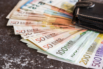 Euro money with wallet on the table. Happy salary day. Money background.