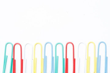 Colorful paper clips on white background