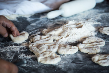 Raw dough for pita on the table