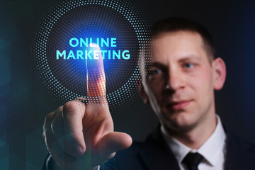 Business, Technology, Internet and network concept. Young businessman working on a virtual screen of the future and sees the inscription: Online marketing