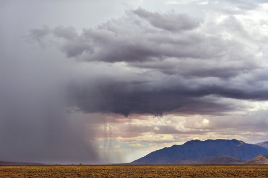 Namibia gravel road C27 storm cloud