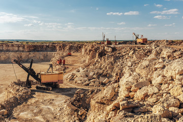Mining quarry concept. Heavy duty machinery, industrial construction industry