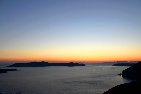 Late Dusk Sunset of Greek Island of Santorini with Ocean and Mountasins