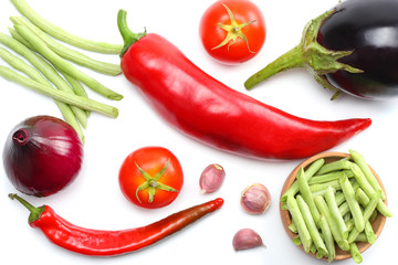 eggplant, tomato, onion, garlic and chili pepper isolated on white background. top view