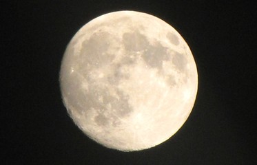 Up close full moon in a black sky