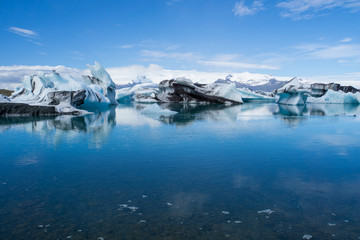Iceland - Giant ice floes on joekulsarlon glacier lagoon with blue sky