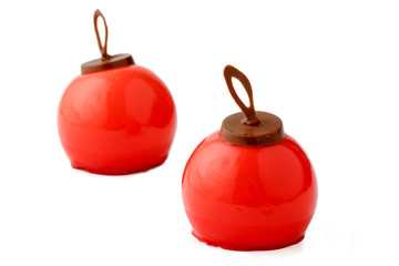 Mousse cakes of red color in the form of a ball