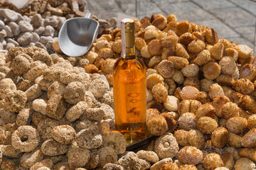 Italy, sicilians sweets with a bottle of typical white wine "Zibibbo".