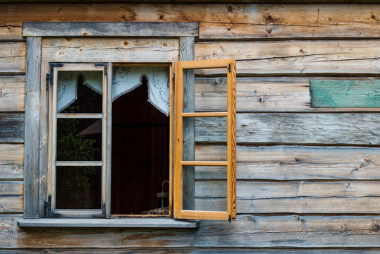Antique wooden wall and opened window