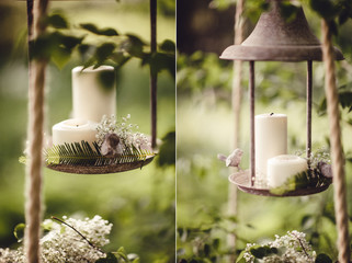 Wedding decor with flowers and candles in the forest