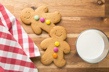 Sweet gingerbread man and glass of milk.
